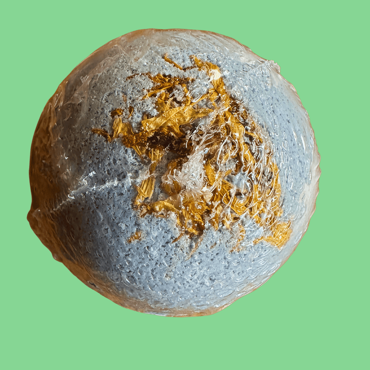 Blue Bath Bomb With Green Background