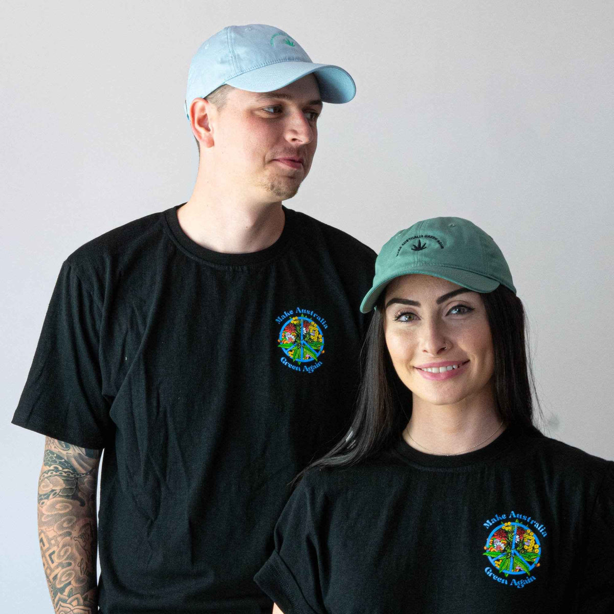 Couple wearing Make Australia Green Cap