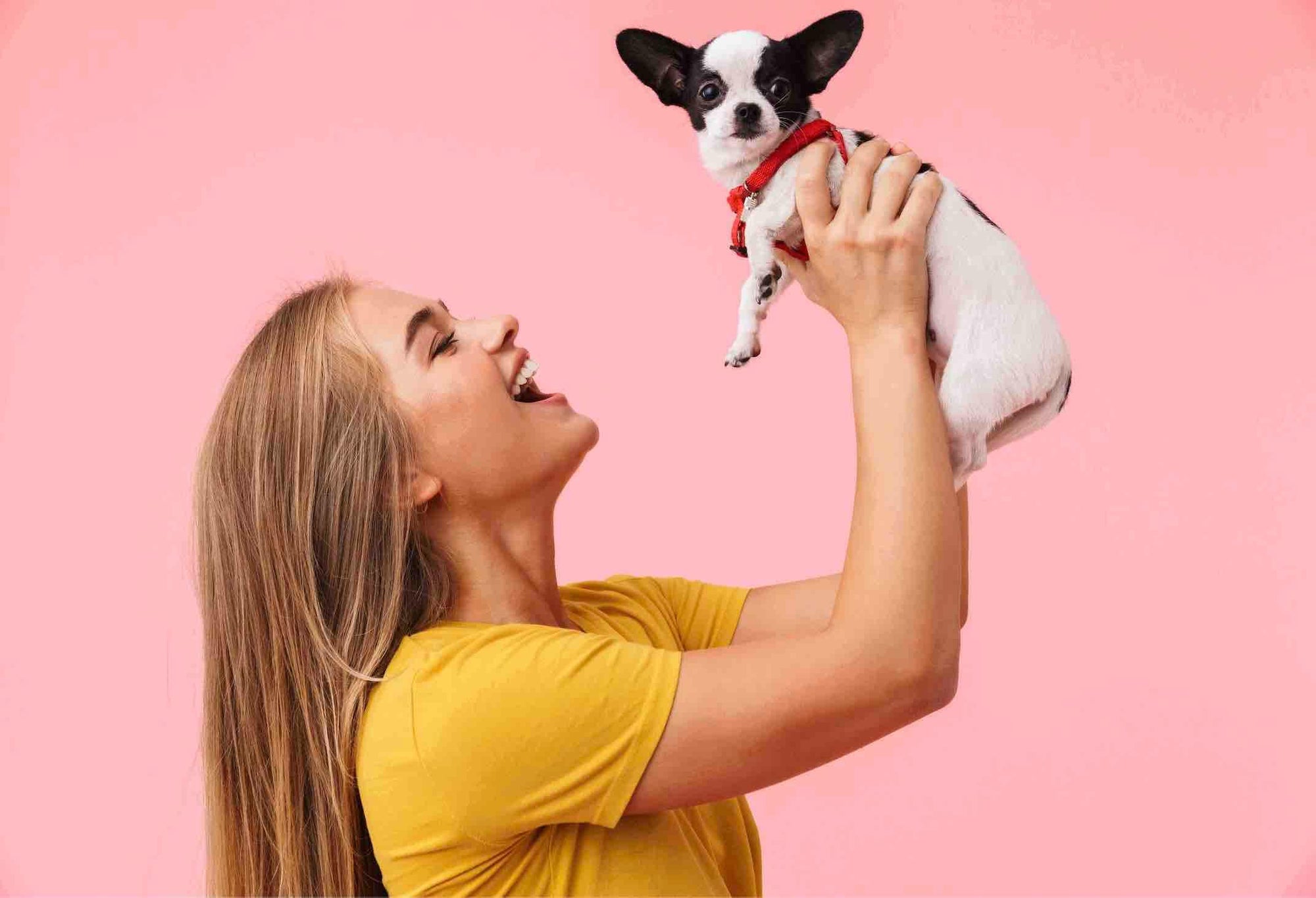 Women holding Dog up