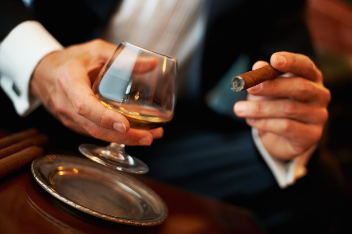 Man with cigar and cognac