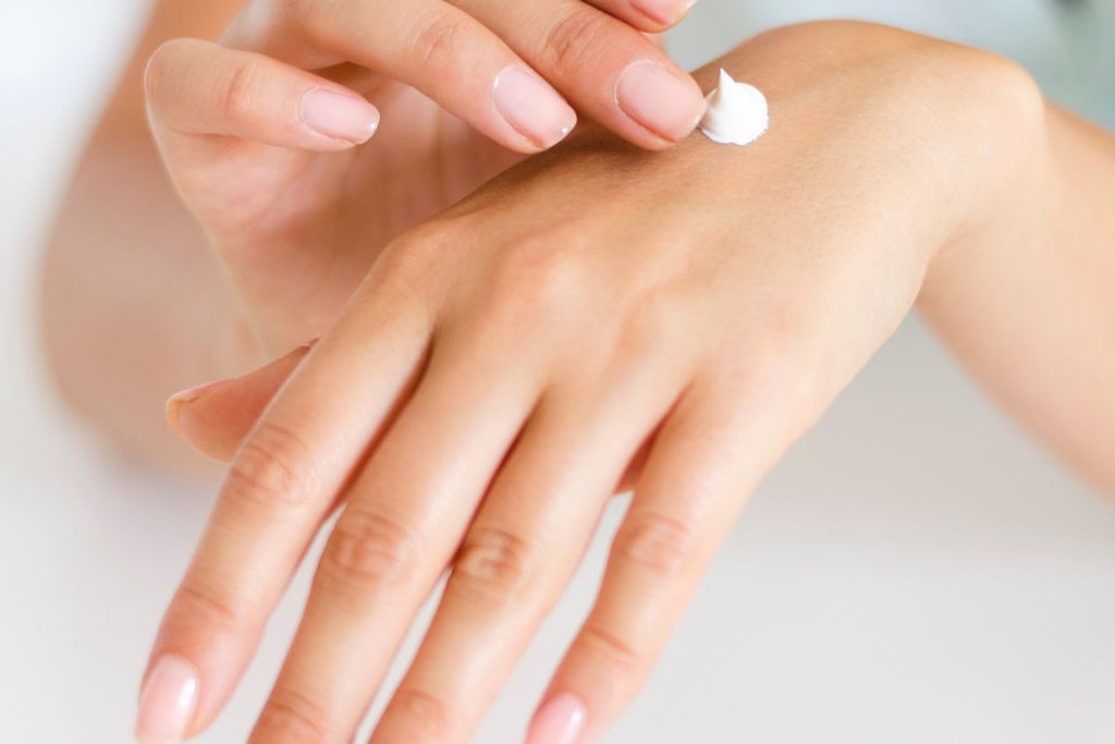 Woman Applying Hand Cream