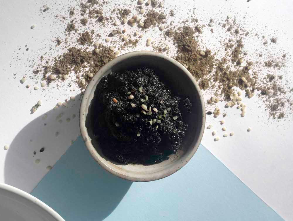 Charcoal face scrub in a bowl