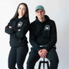 Couple wearing Green Altar Black Cotton Hoodie